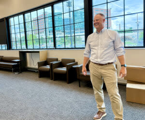 Michael Dixon, CEO of UNeMed, and his team is settling into their new office space at the Catalyst. Through the windows to the east is the University of Nebraska Medical Center’s main campus. (Cindy Gonzalez/Nebraska Examiner)