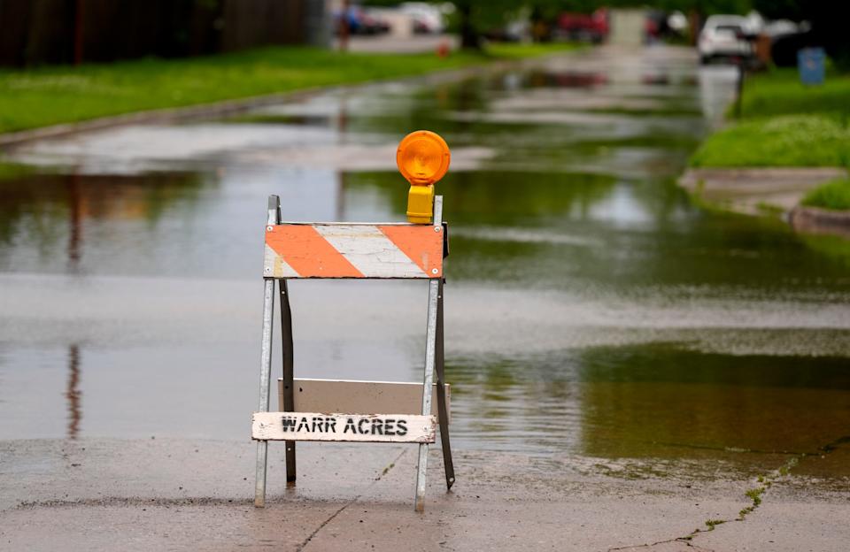 Water covers the intersection of NW 35 and N Hammond Avenue in Warr Acres, Okla., Wednesday, April 30, 2025.