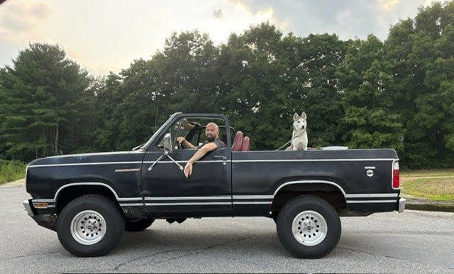 Brian Kreizinger, an art teacher at Taunton High School who died of cancer on April 17, 2025, is seen here in his Ramcharger truck with his dog Willow.