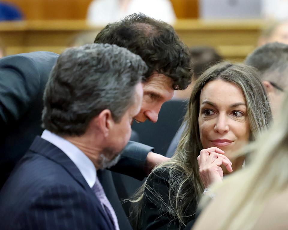 Defendant Karen Read, right, confers with her attorneys Alan Jackson, left, and Robert Alessi, center, before Read's trial in Norfolk Superior Court, Friday, May 16, 2025, in Dedham, Mass. (Mark Stockwell/The Sun Chronicle, Pool)