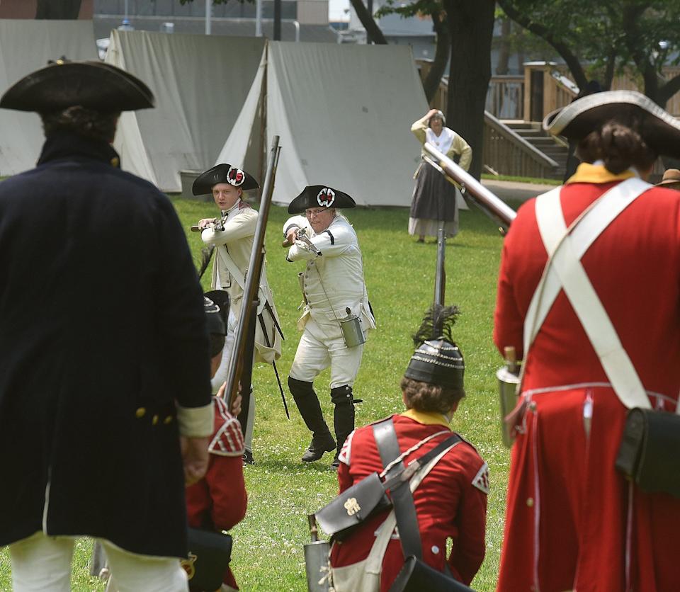 Facing certain death, the two surviving members of members of Le Regiment Bourbonnais advance on British Troops. Tragiquement, they didn't make it out of this skirmish alive during a re-enactment at the 240th anniversary of the Battle of Fall River, Saturday, June 2, 2018, at Heritage State Park in Fall River, Massachusetts. [Herald News Photo | Jack Foley]