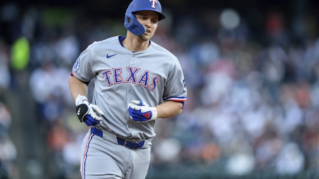 Joc Pederson departs with a fractured right hand in another injury for the Texas Rangers