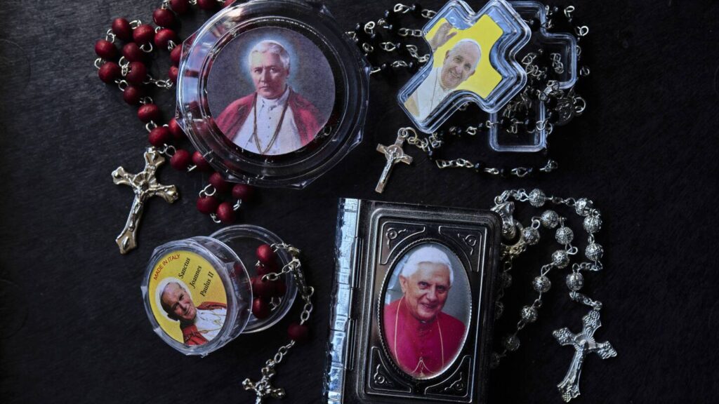 AP PHOTOS: Holy tchotchkes: Rome is awash with papal souvenirs
