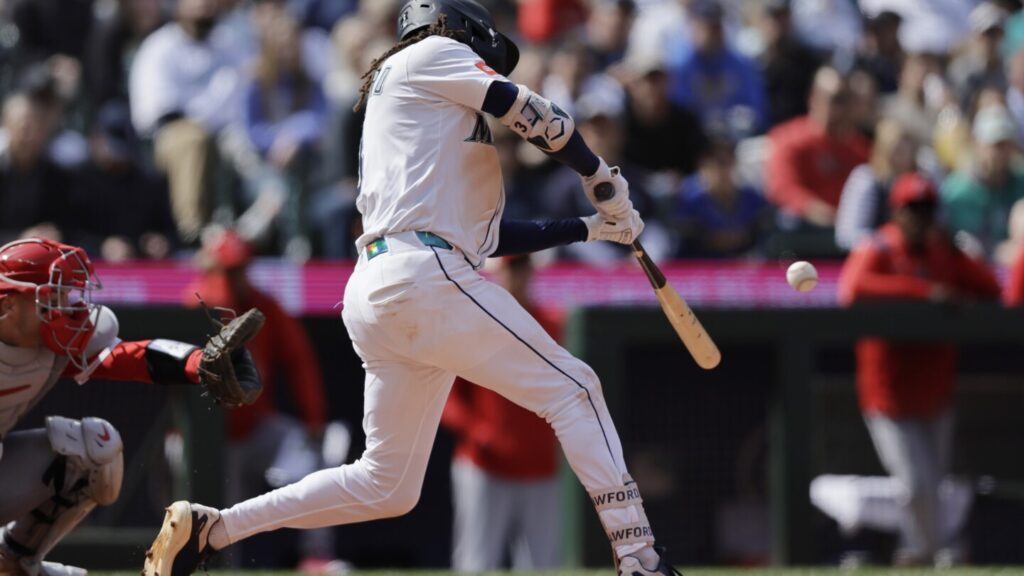 Surging Mariners beat Angels 9-3; Trout leaves game early with sore knee