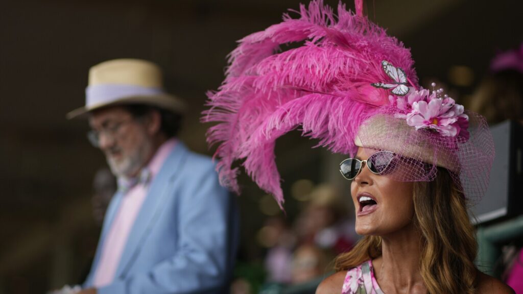 Colorful plumed hats fills Churchill Downs as fans embrace the 151st Kentucky Derby