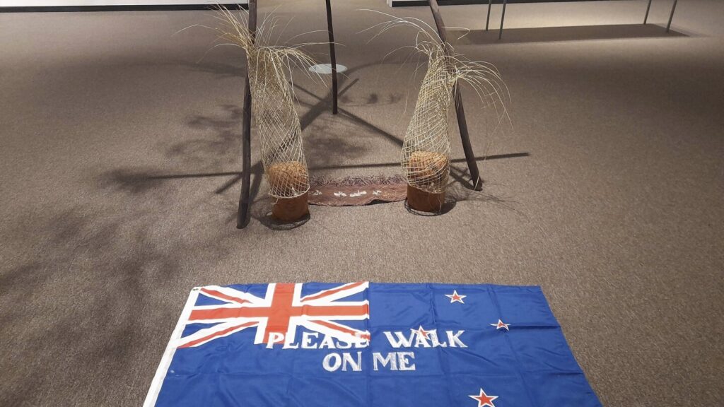 Protests over ‘please walk on me’ flag artwork prompt removal from New Zealand gallery