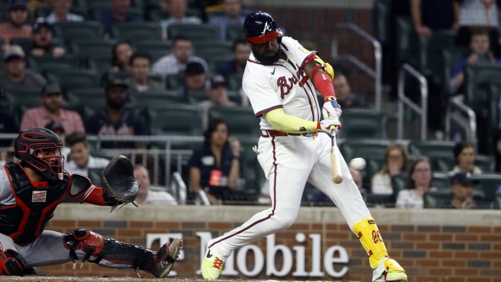 Harris and Ozuna deliver clutch hits as Braves rally past slumping Reds 2-1 in 10 innings