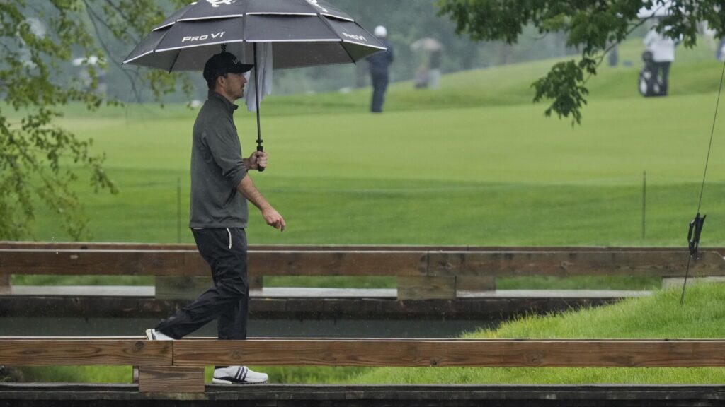 Nick Taylor makes it look easy in the rain and shares the lead at Memorial