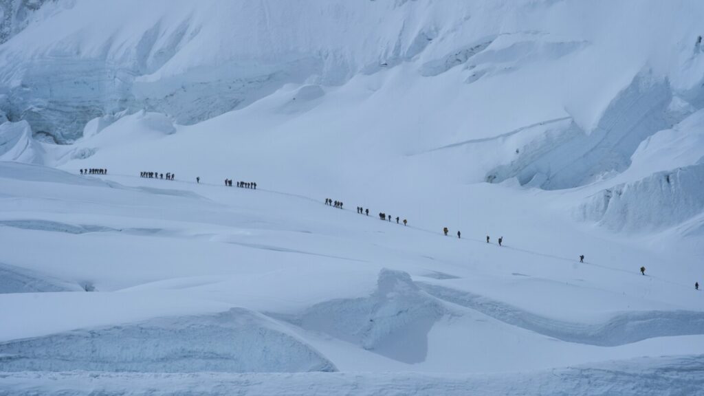 Climbers struggle against the weather on Mount Everest