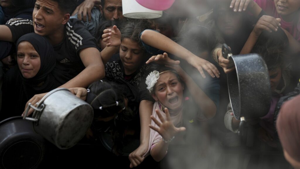Desperate children and adults in Gaza struggle to get food as Israel blocks aid
