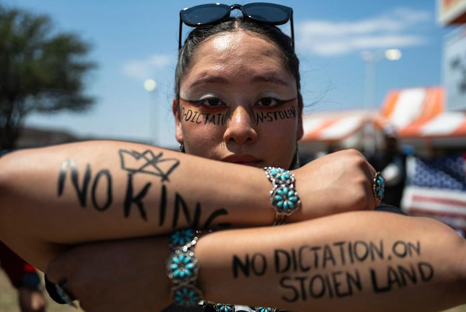 Santianna Chavez, a demonstrator representing the Navajo Nation, poses for a photo during a No Kings Day protest on Saturday, June 14, 2025, in Odessa.