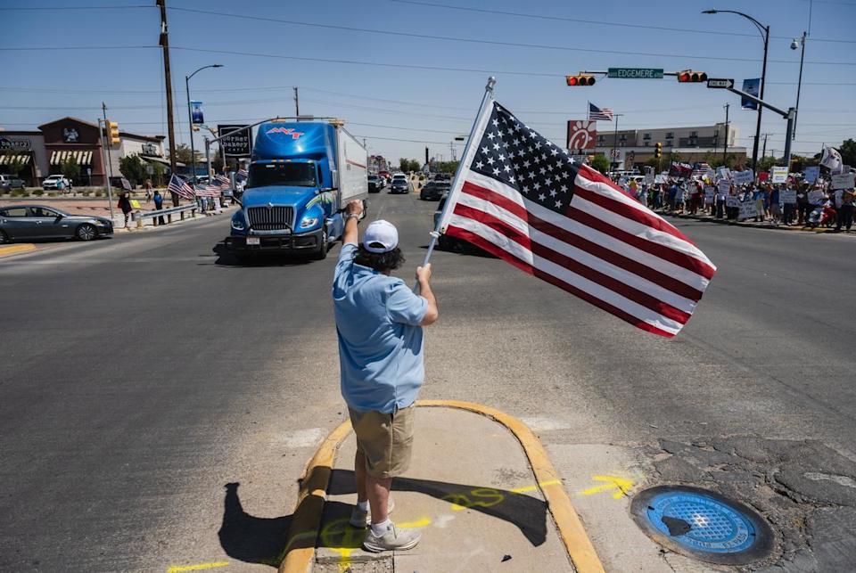 Thomas Arditti waves an American flag in the middle of Airway Blvd. during the No Kings protest in El Paso, Texas on June 14, 2025.