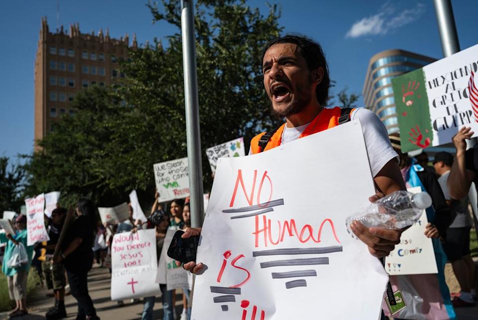A protest organizer leads in a chant during a No Kings Day demonstration on Saturday, June 14, 2025, in downtown Midland.