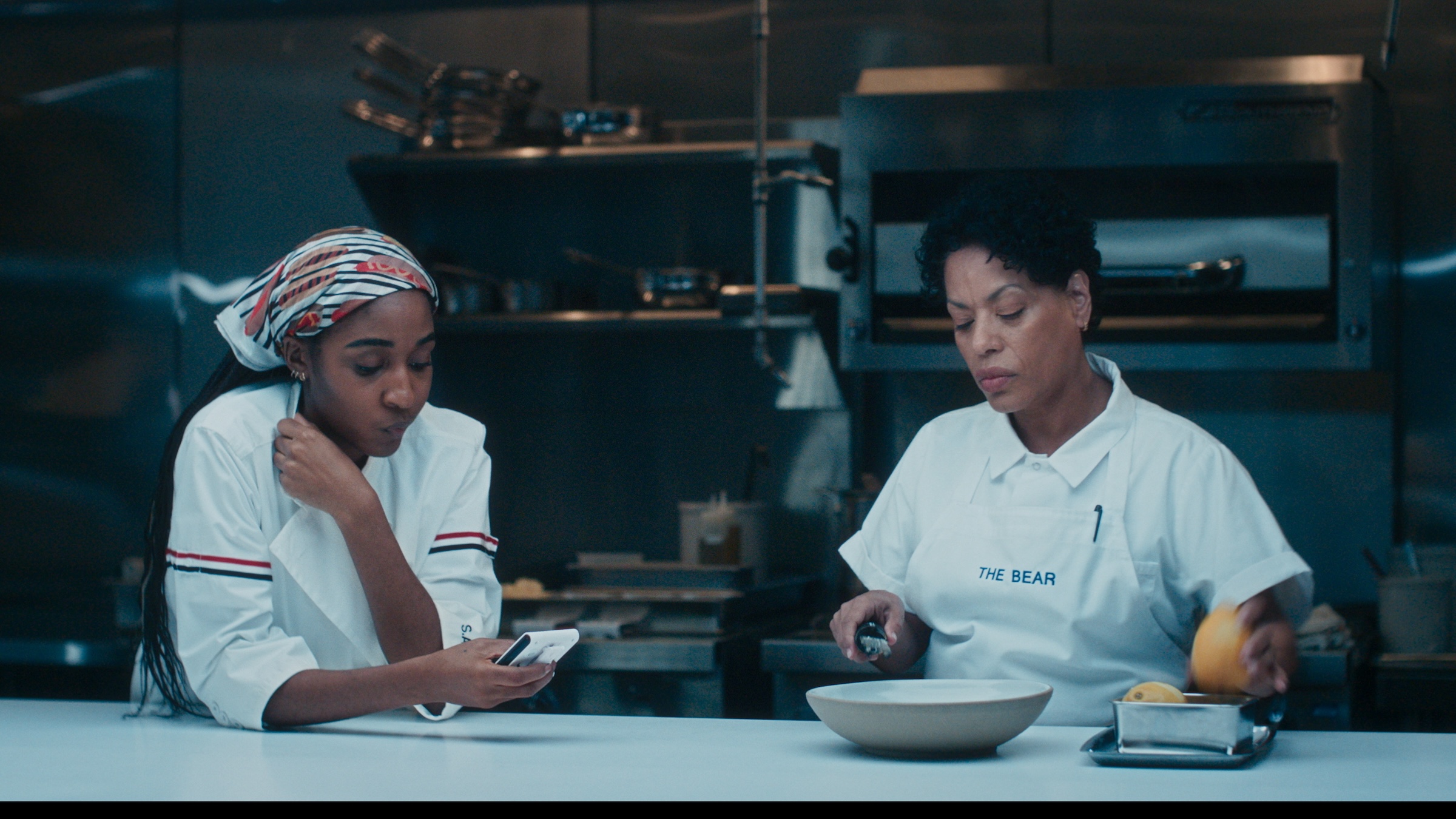The Bear - Season 4 -- Pictured: (l-r)  Ayo Edebiri as Sydney Adamu, Liza Colon-Zayas as Tina. CR: FX