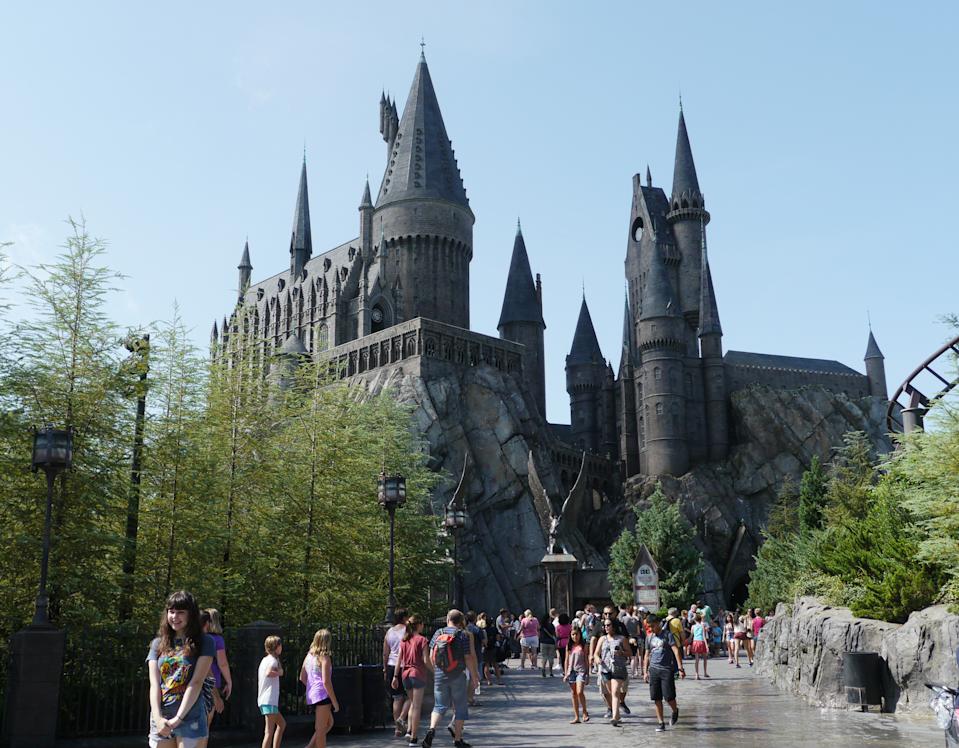 ORLANDO, FLORIDA, USA—Visitors flock to the Hogwarts Castle at Universal Studios theme park in Orlando, Florida in August 2015.