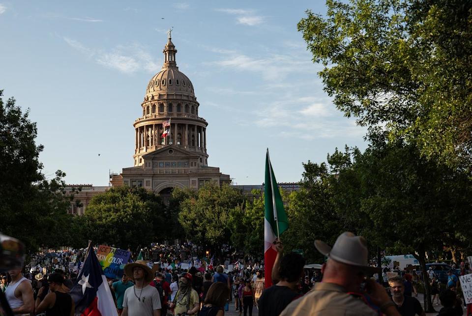 A Texas State Trooper looks on as thousands participate in a No Kings demonstration in Austin on June 14, 2025.
