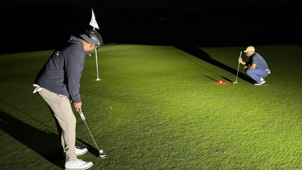 Flashlights and glowing golf balls: NY man plays for 35 hours in record attempt